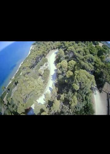 an aerial view of a mountain with a road on it at Villa-Alpha in Kassandria