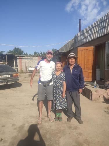 a group of three people posing for a picture at "Martin" guest house in Kara-Talaa