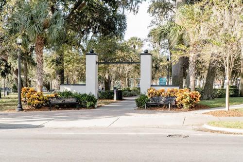 a park with benches and trees and palm trees at Walk Everywhere! 1-bedroom Gem In Downtown Hub in New Port Richey