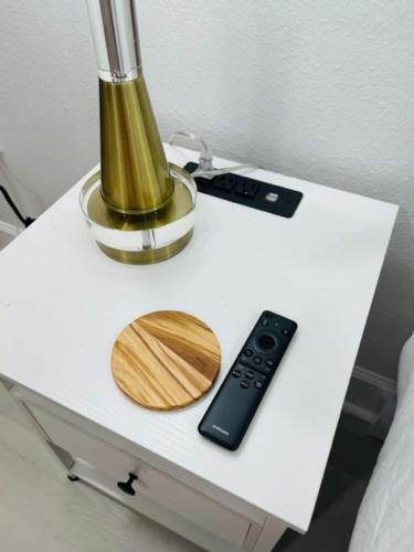 a table with a blender and a remote control on it at Walk Everywhere! 1-bedroom Gem In Downtown Hub in New Port Richey
