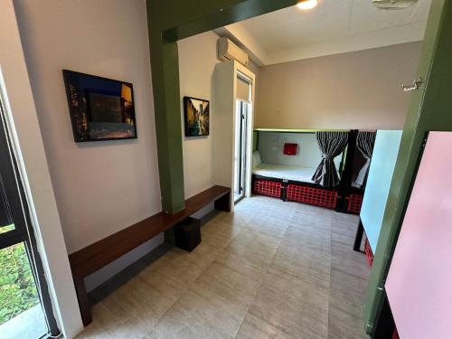 a hallway with a room with a bed in it at Mad Monkey Hoi An in Hoi An