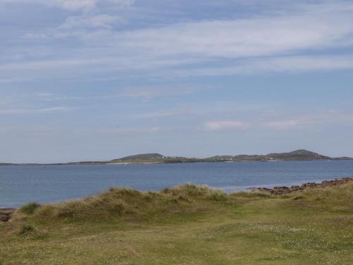 a large body of water with mountains in the background at The Island's View in Letterkenny