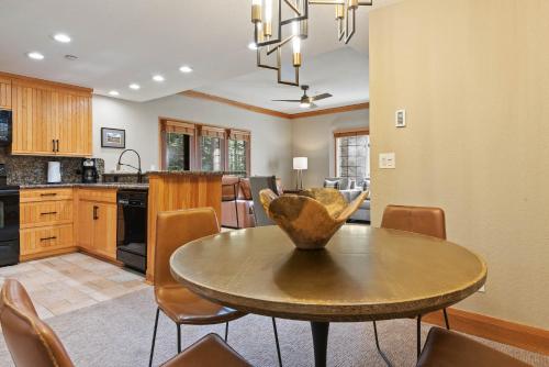 a kitchen and dining room with a table and chairs at The Charter at Beaver Creek C020 in Beaver Creek