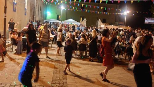 a crowd of people standing in front of a concert at Casa Vacanze Piazza Apartment 2 in SantʼAndrea di Conza