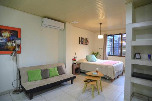 Ένα ή περισσότερα κρεβάτια σε δωμάτιο στο Beach Break Santa Teresa Apartamentos