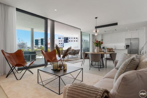 a living room with a couch and chairs and a table at ViVi Homes - El Valle Pool & Sea View in Fuengirola
