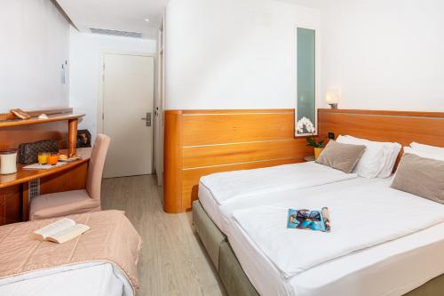 Postel nebo postele na pokoji v ubytování Park Hotel