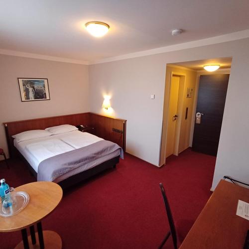 Katil atau katil-katil dalam bilik di TRIP INN PostHotel Düren