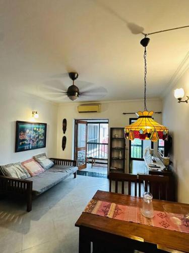 a living room with a couch and a table at Cim and Sands in Goa