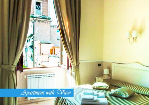 a bed in a room with a large window at Bed & Breakfast Medea in Naples