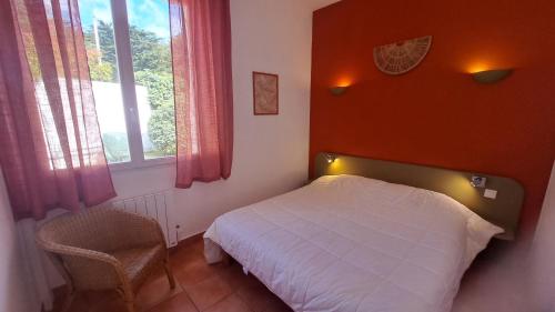 Llit o llits en una habitació de Résid'Azur