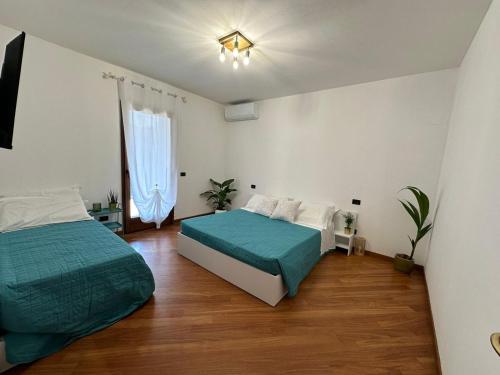 Postel nebo postele na pokoji v ubytování Villa Aurora in Erbusco-Franciacorta