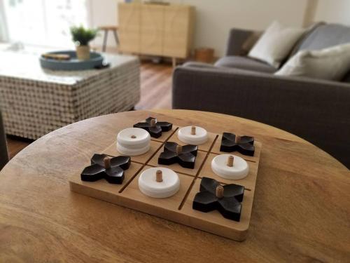 a remote control sitting on a table in a living room at South Beach Bungalow in Point Roberts
