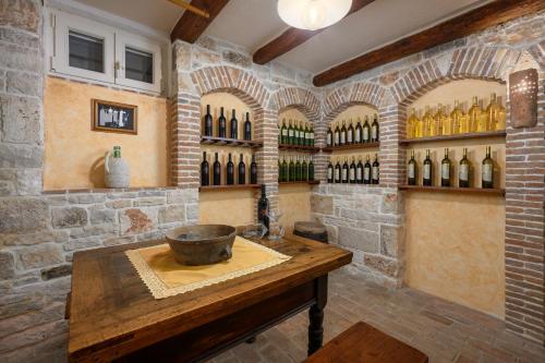 a tasting room with a bunch of wine bottles at Villa Lipa in Krnica