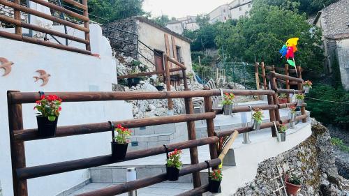 a stairway with potted plants on the side of a building at La Mansarda di Terelle in Terelle