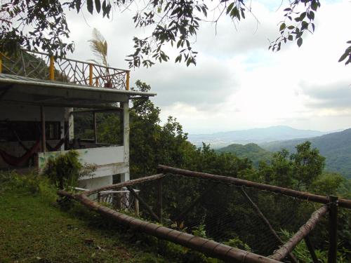 a house on the side of a hill with a view at Dunarinka in Minca