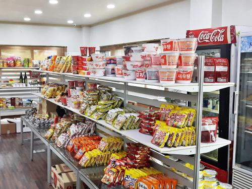a store filled with shelves filled with lots of food at Jeju I've Hotel & Resort in Seogwipo