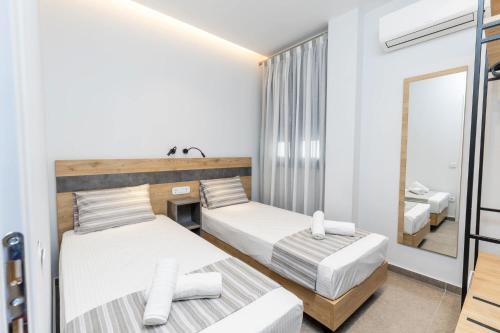 Ένα ή περισσότερα κρεβάτια σε δωμάτιο στο Enalia Luxury Living