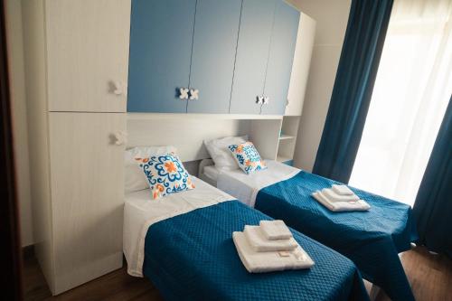 Postel nebo postele na pokoji v ubytování Vossia Casa Vacanze