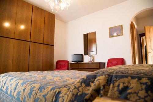 Letto o letti in una camera di B&B Nuovo Paradiso