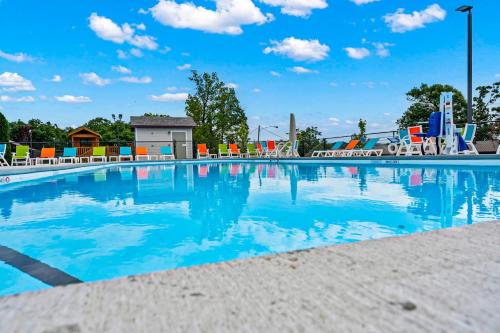 a swimming pool at a park with a playground at Table Rock Retreat in Kimberling City