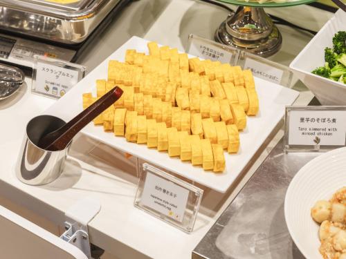 a tray of crackers on a display case in a store at Sotetsu Fresa Inn Hiroshima in Hiroshima