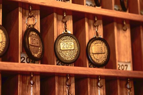 a row of clocks on a wooden wall at Hotel Camigliatello in Camigliatello Silano
