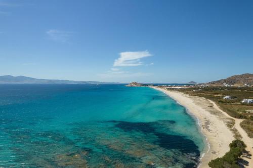 an aerial view of a beach with turquoise water at Helen Beach Front Luxury Villas in Kastraki Naxou