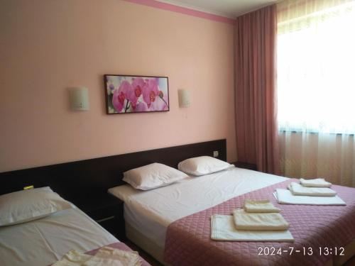 Giường trong phòng chung tại Central Plaza Apartment