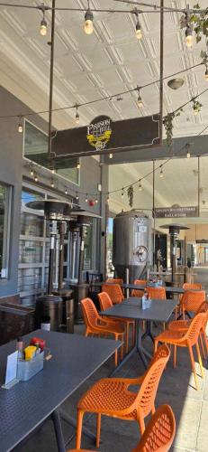 a restaurant with tables and chairs and a grill at Casa Sunrise, Large Home, Minutes from Airport, YRMC, Mexico Borders in Yuma