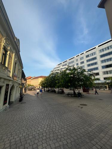 a street in a city with a large building at City room Zagreb in Zagreb