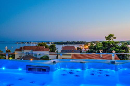 a view from the roof of a house with a swimming pool at Luxury Apartments VilaMaloca in Vir
