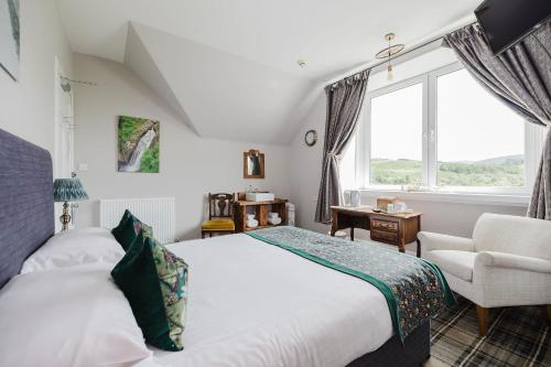 a bedroom with a bed and a chair and a window at Whitebridge Hotel in Whitebridge