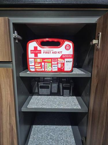 a cabinet with a first aid kit sitting on a shelf at Casa Angulo 8 Guest Gated Home in Viñedos Del Mar in El Suazal