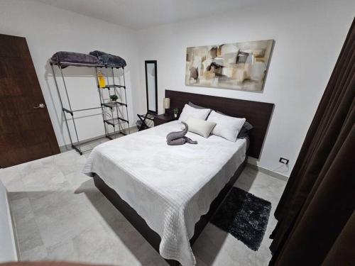a bedroom with a large bed in a room at Casa Angulo 8 Guest Gated Home in Viñedos Del Mar in El Suazal