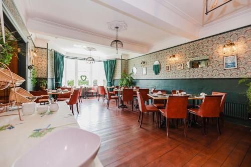 a restaurant with tables and chairs in a room at Whitebridge Hotel in Whitebridge