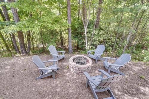 a group of chairs sitting around a fire pit at Hot Tub and EV Charger Helen Getaway with Views! in Helen
