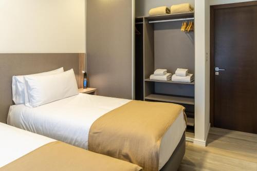Postel nebo postele na pokoji v ubytování Espacio Terra Apartamentos