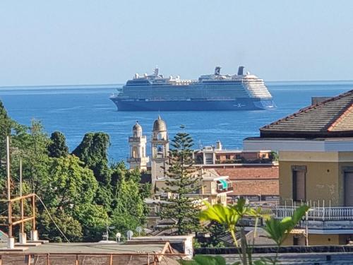 a cruise ship in the ocean with a city at Appartamento Rapallo Sky Garden Maria Jose Liguria - Attico vista mare - Terraces - 2 bagni- 2 Camera da Letto - Box, Wi-fi, Idromassaggio Free inteiro Attico per Voi, con Ascensore in Rapallo