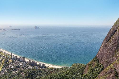 a view of the ocean from the top of a mountain at Hotel Nacional Rio de Janeiro - OFICIAL in Rio de Janeiro