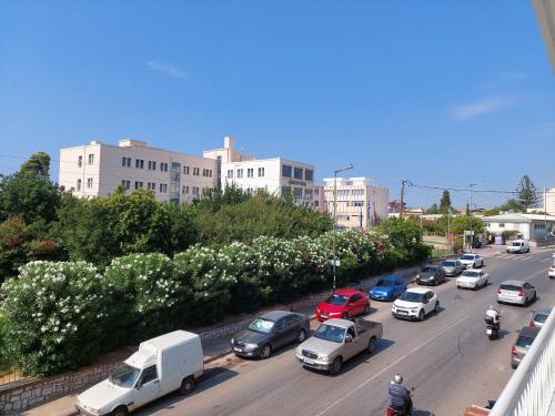 a busy city street filled with cars and buildings at Natasa's Appartment in Kalamata in Kalamata