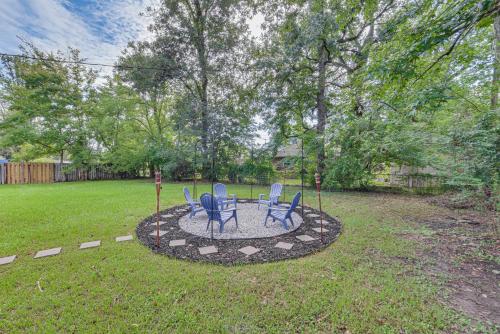 two blue chairs sitting on a circle in a yard at Baton Rouge Home with Yard about 14 Mi to Downtown! in Baton Rouge