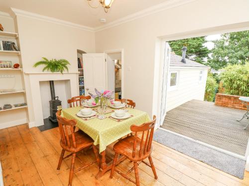 a dining room with a table and chairs at Seagulls Perch in Cowes