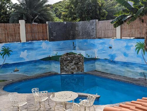 Bazén v ubytování 1BR Suite at Villa Costa Verde near Playa Cofresi, Puerto Plata, with a pool, balcony and a rooftop terrace nebo v jeho okolí