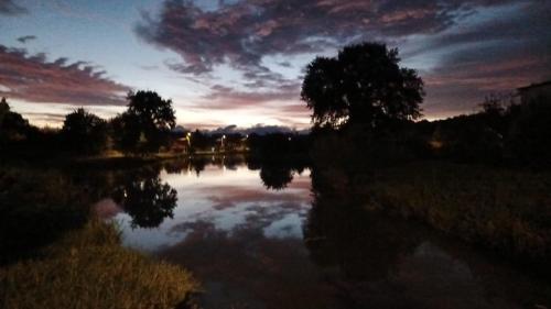 a view of a body of water at sunset at Osada Karszewo, sauna bania, ryby in Karszewo