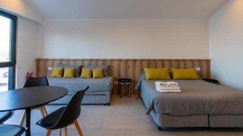 Giường trong phòng chung tại Utaka Cabañas y Apartamentos