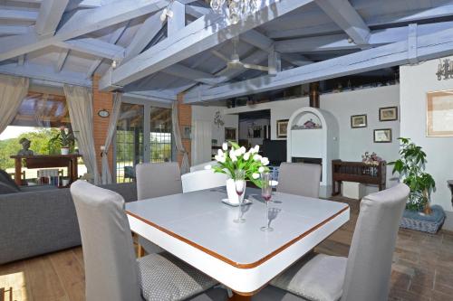 a dining room with a table and chairs at Villa Borgiano - Happy Rentals in Scansano