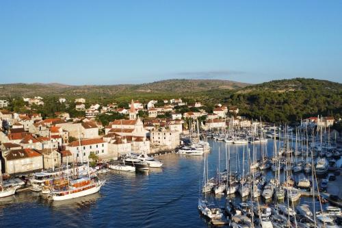 a bunch of boats are docked in a harbor at Luxury Villa Kate - in Lucice Bay with turquoise sea, Amazing Seaviews, and Heated Pool in Milna