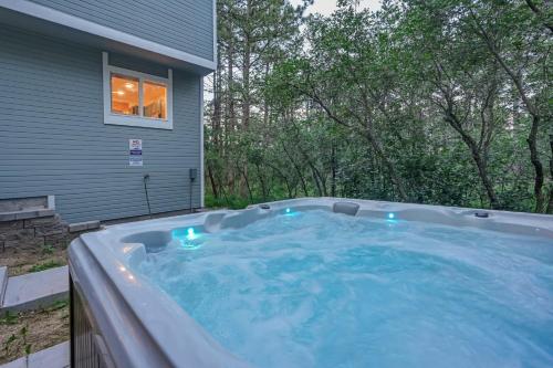 a hot tub in the backyard of a house at Fox Run Retreat Hot Tub & Fire Pit & BBQ in Colorado Springs