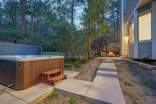 a backyard with a hot tub and a fire pit at Fox Run Retreat Hot Tub & Fire Pit & BBQ in Colorado Springs
